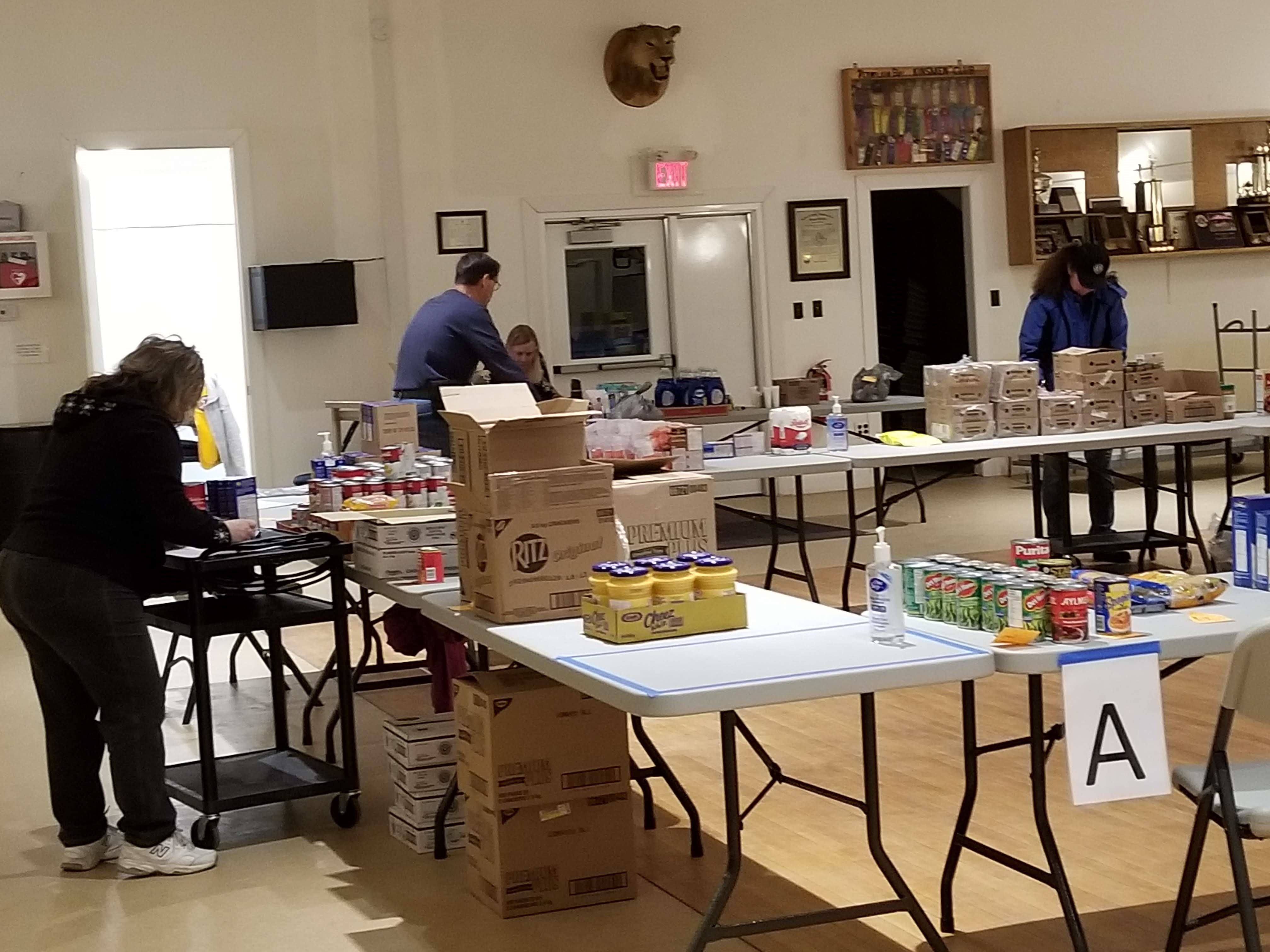Lions sort items to be distributed to local food pantries